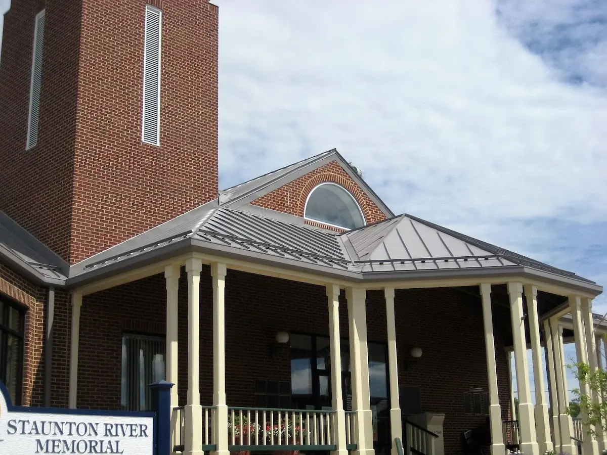 Skilled roofing craftsmen working on a residential roof in Youngsville